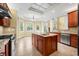 Open kitchen boasts granite countertops, a central island, and a breakfast area with backyard access at 1008 Westcreek Dr, Columbus, IN 47201