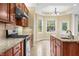 Well-lit kitchen showcases granite countertops, stainless steel appliances, and an adjacent breakfast nook at 1008 Westcreek Dr, Columbus, IN 47201