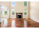 Bright living room boasting a fireplace, hardwood floors, and large windows for ample natural light at 1008 Westcreek Dr, Columbus, IN 47201