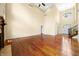 Bright and expansive living room with hardwood floors, a fireplace, and tall ceilings, perfect for entertaining at 1008 Westcreek Dr, Columbus, IN 47201