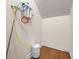 Utility room with wooden floors and water filtration system at 1008 Westcreek Dr, Columbus, IN 47201