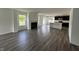 Open concept living space flows into kitchen, with vinyl flooring, fireplace, and plenty of natural light at 10144 Camp Creek Way, Indianapolis, IN 46229