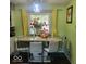 Cozy dining area with a marble table and comfortable seating, perfect for Gathering meals at 10210 E 33Rd St, Indianapolis, IN 46235