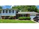Charming two-story home with a brick facade and manicured lawn at 10210 E 33Rd St, Indianapolis, IN 46235