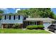 Charming two-story home with a brick facade and manicured lawn at 10210 E 33Rd St, Indianapolis, IN 46235