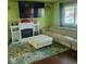 Bright living room with a fireplace, comfortable seating, and stylish decor at 10210 E 33Rd St, Indianapolis, IN 46235