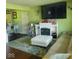 Bright living room with a fireplace, comfortable seating, and stylish decor at 10210 E 33Rd St, Indianapolis, IN 46235