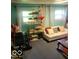 Cozy room with two windows and neutral-toned furniture at 10210 E 33Rd St, Indianapolis, IN 46235