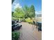 Spacious back deck with seating, dining table, and potted plants, perfect for entertaining outdoors at 10477 Silver Ridge Cir, Fishers, IN 46038