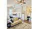 Bright eat-in kitchen showcasing updated appliances, quartz counters, island, and eat-in counter seating at 10477 Silver Ridge Cir, Fishers, IN 46038
