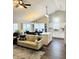 An expansive living area with a vaulted ceiling, fireplace, and open layout to the kitchen and dining at 10477 Silver Ridge Cir, Fishers, IN 46038
