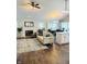Open concept living area featuring a fireplace, lots of windows, and an eat in kitchen at 10477 Silver Ridge Cir, Fishers, IN 46038