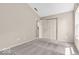 A carpeted bedroom with a double closet and a view at 1139 Fernwood Way, Plainfield, IN 46168