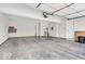 Spacious two-car garage with white walls, concrete floor, and ample storage space at 1139 Fernwood Way, Plainfield, IN 46168