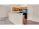 Open concept kitchen features granite counters, wood cabinets, and stainless steel appliances at 1139 Fernwood Way, Plainfield, IN 46168