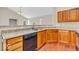 Beautiful kitchen with granite counters, stainless appliances, and attractive wood floors at 1139 Fernwood Way, Plainfield, IN 46168
