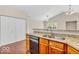 Kitchen features granite countertops, stainless appliances, and stylish wood flooring at 1139 Fernwood Way, Plainfield, IN 46168