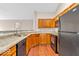 Bright kitchen showcasing granite countertops, stainless steel appliances and wood cabinetry at 1139 Fernwood Way, Plainfield, IN 46168