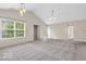 Spacious living room featuring lots of natural light and vaulted ceilings at 1139 Fernwood Way, Plainfield, IN 46168