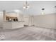 Open floor plan with living room and kitchen featuring vaulted ceilings and neutral colors at 1139 Fernwood Way, Plainfield, IN 46168