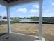 Backyard view towards neighborhood pond with fountain at 114 Velvet Hat Rd, Danville, IN 46122