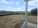 Backyard view towards neighborhood pond and green space at 114 Velvet Hat Rd, Danville, IN 46122
