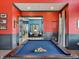 Elegant game room featuring a classic pool table, refined decor, and access to additional community spaces at 114 Velvet Hat Rd, Danville, IN 46122