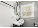Bathroom featuring a modern vanity, sleek fixtures, and a large mirror at 1205 Park Dr, Lebanon, IN 46052