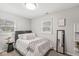 Bedroom with great natural light, neutral decor, and a modern accent mirror at 1205 Park Dr, Lebanon, IN 46052