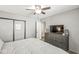 Cozy bedroom featuring a ceiling fan and dresser with TV at 1205 Park Dr, Lebanon, IN 46052