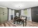 Dining area with lots of natural light, modern lighting, and stylish wainscoting at 1205 Park Dr, Lebanon, IN 46052