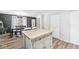 Kitchen island in an open floor plan with an adjoining dining space at 1205 Park Dr, Lebanon, IN 46052
