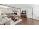 Cozy living room featuring neutral paint, hardwood floors, a stone fireplace and comfortable seating at 1205 Park Dr, Lebanon, IN 46052