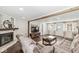 Inviting living room features a fireplace, wood beam accents, and lots of natural light at 1205 Park Dr, Lebanon, IN 46052