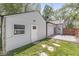 Showing rear exterior of the home with a door and window, as well as a patio area at 1205 Park Dr, Lebanon, IN 46052