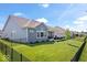 Spacious backyard features a fence, patio, and views of the neighborhood at 12078 Black Mill Pass, Fishers, IN 46040