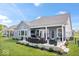 Backyard patio with furniture, heaters, dining and views of the fenced-in yard at 12078 Black Mill Pass, Fishers, IN 46040