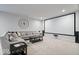 Finished basement features projector screen, comfortable seating area, and carpet floors at 12078 Black Mill Pass, Fishers, IN 46040