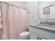 Cozy bathroom with a patterned shower curtain and a white vanity at 12078 Black Mill Pass, Fishers, IN 46040