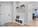 Functional entryway featuring storage, coat hooks, and comfortable seating area with a bench at 12078 Black Mill Pass, Fishers, IN 46040