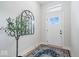 Inviting entryway with a decorative mirror, stylish rug, and a bright white front door at 12078 Black Mill Pass, Fishers, IN 46040