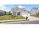 Attractive home with a well-kept lawn, two car garage, and appealing architectural details at 12078 Black Mill Pass, Fishers, IN 46040
