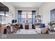 Well-lit home office featuring natural light, blue accents, and hardwood floors at 12078 Black Mill Pass, Fishers, IN 46040