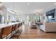 Open-concept living space seamlessly connecting the modern kitchen and cozy living room at 12078 Black Mill Pass, Fishers, IN 46040