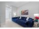 Comfortable living room with a large blue sectional sofa and stylish decor at 12078 Black Mill Pass, Fishers, IN 46040