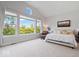 Bright main bedroom with a vaulted ceiling, large windows, and a comfortable seating area at 12078 Black Mill Pass, Fishers, IN 46040