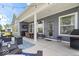 Covered patio with outdoor seating, dining area, and grill for outdoor gatherings at 12078 Black Mill Pass, Fishers, IN 46040