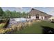 Residents relax at a community pool with ample deck space, lush landscaping and plenty of seating at 12078 Black Mill Pass, Fishers, IN 46040