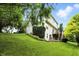 Expansive backyard with lush green lawn, landscaping, and views of the house, great for outdoor activities at 13020 Lombard Ct, Fishers, IN 46038