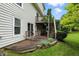 A view of the home's back deck and yard, complemented by lush landscaping at 13020 Lombard Ct, Fishers, IN 46038